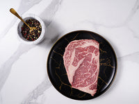 American Waguy Ribeye MS 10 16oz top view with peppercorns