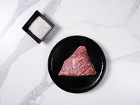 Australian Wagyu Picanha Corner Slice MS 9 with salt on marble background - Halal Wagyu